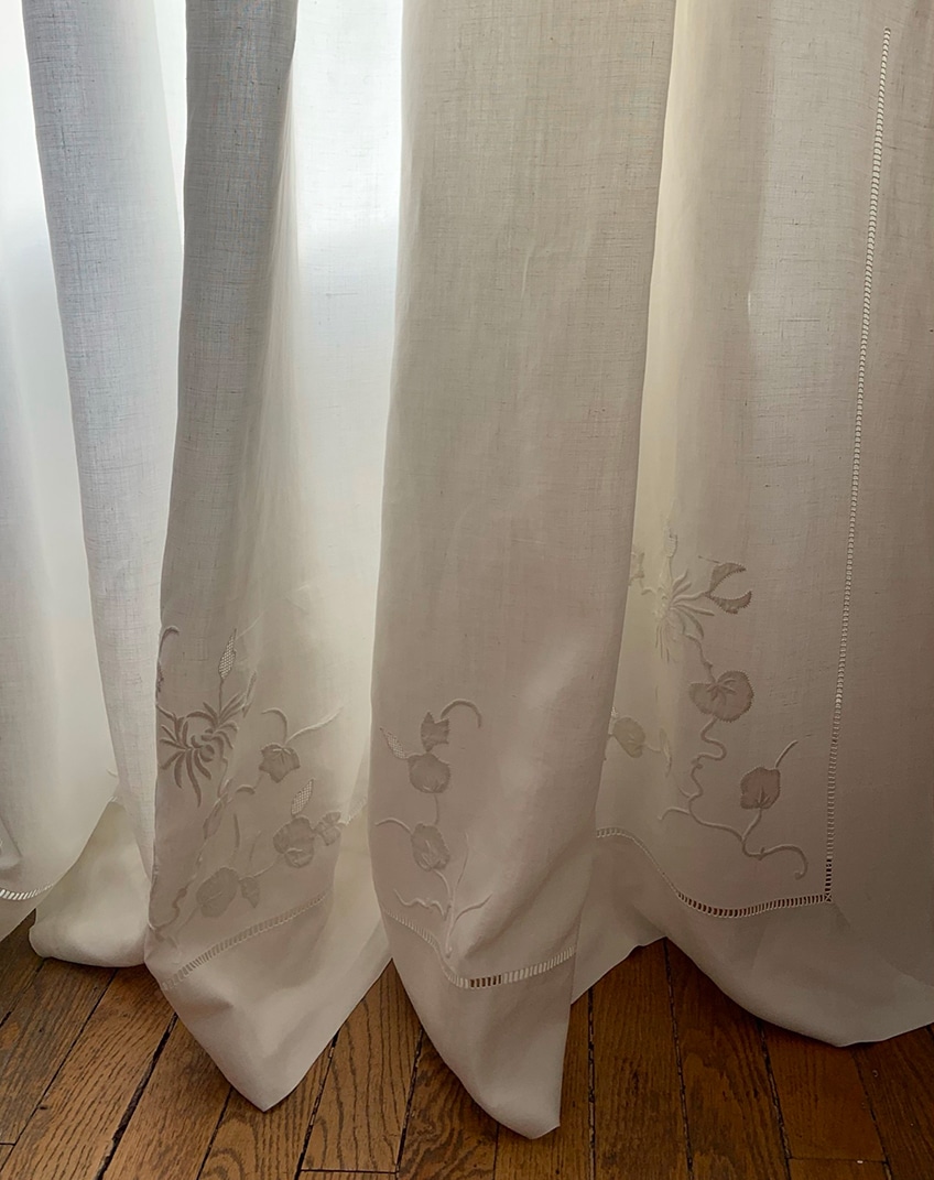 WINDOW curtains in vintage fabrics adorned with hemstitches, heraldry and embroideries